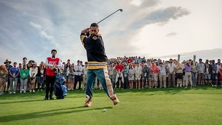 Adam Sandler as Happy Gilmore, swinging a golf club while a crowd watches