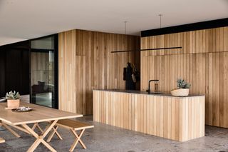 Oak slated kitchen with wooden bench table