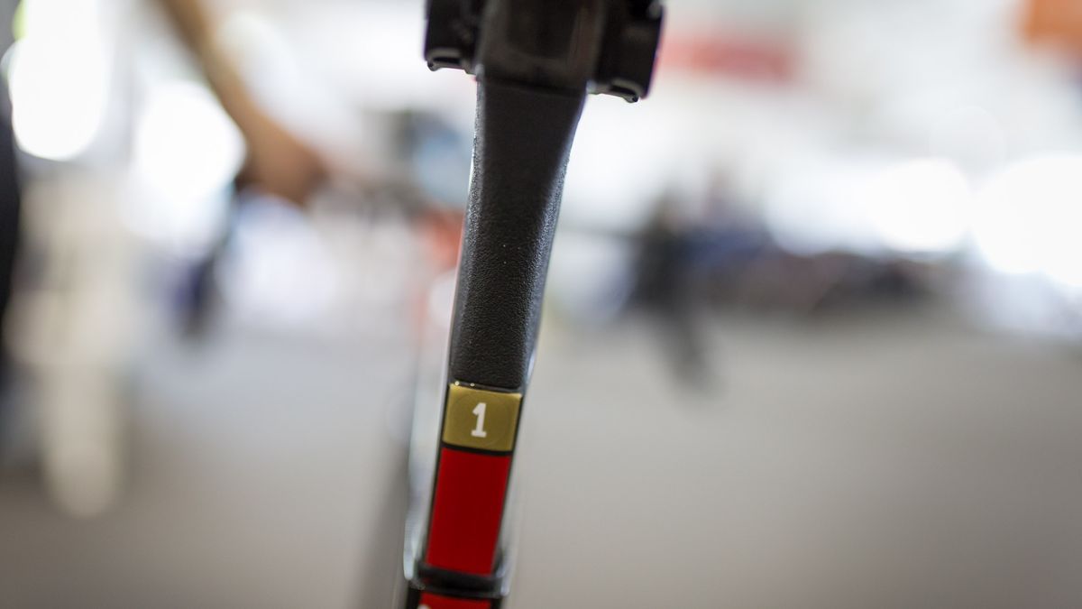 A number 1 sticker marks Arashiro's race bike over the spare bike