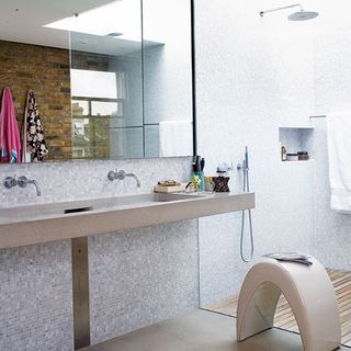 bathroom with mosaic tiles and shower area