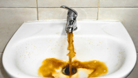 dirty water coming out of a tap