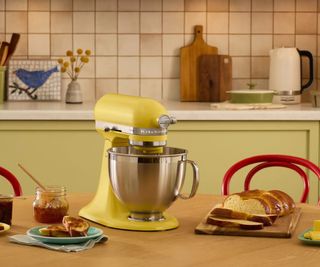 A retro tablescape showcasing KitchenAid's 2025 Color of the Year Stand Mixer: Butter