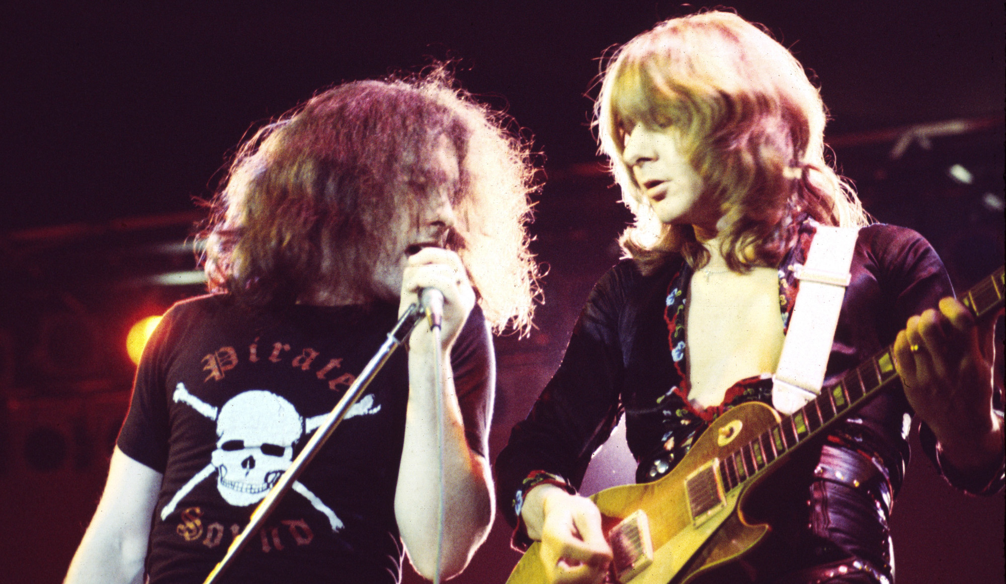Paul Rodgers (left) and Mick Ralphs perform onstage with Bad Company in 1976
