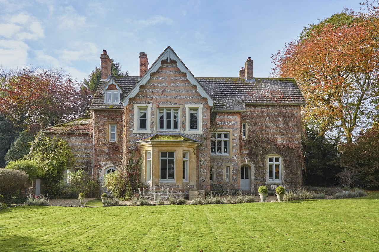 victorian vicarage house_exterior lawn trees brickwork baywindow