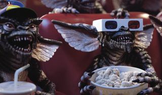 Gremlins enjoying a movie and some popcorn