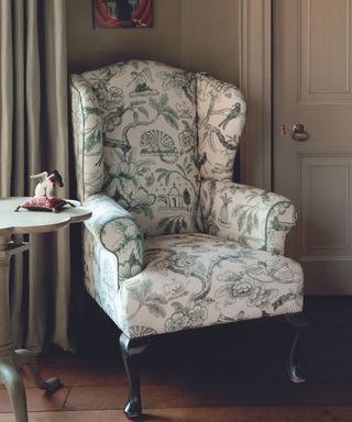 French decor toile fabric armchair in corner of living room