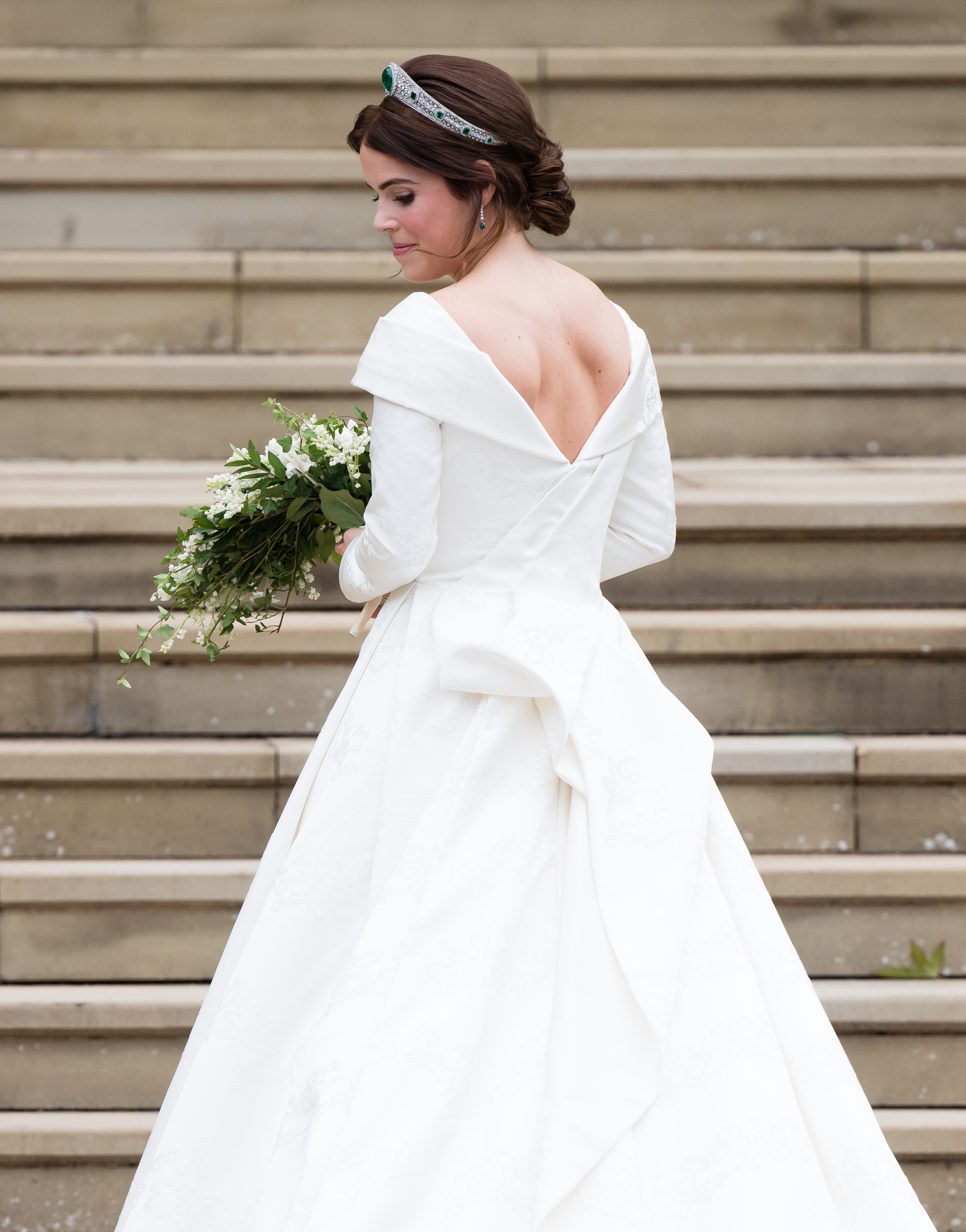 Princess Eugenie shows her scoliosis surgical scar in her wedding gown at St George's Chapel in Windsor Castle in October 2018
