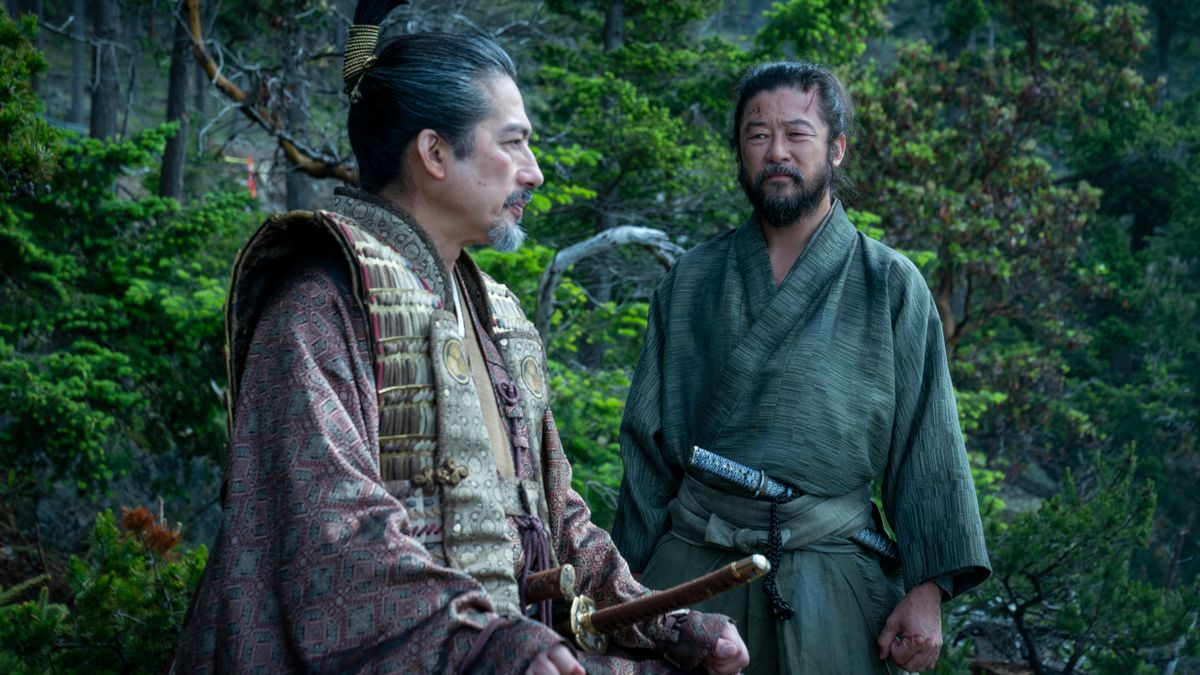 Hiroyuki Sanada sits in conversation with a standing Tadanobu Asano in Shōgun.