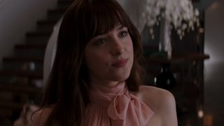 Dakota Johnson in a pink dress in 50 Shades of Grey
