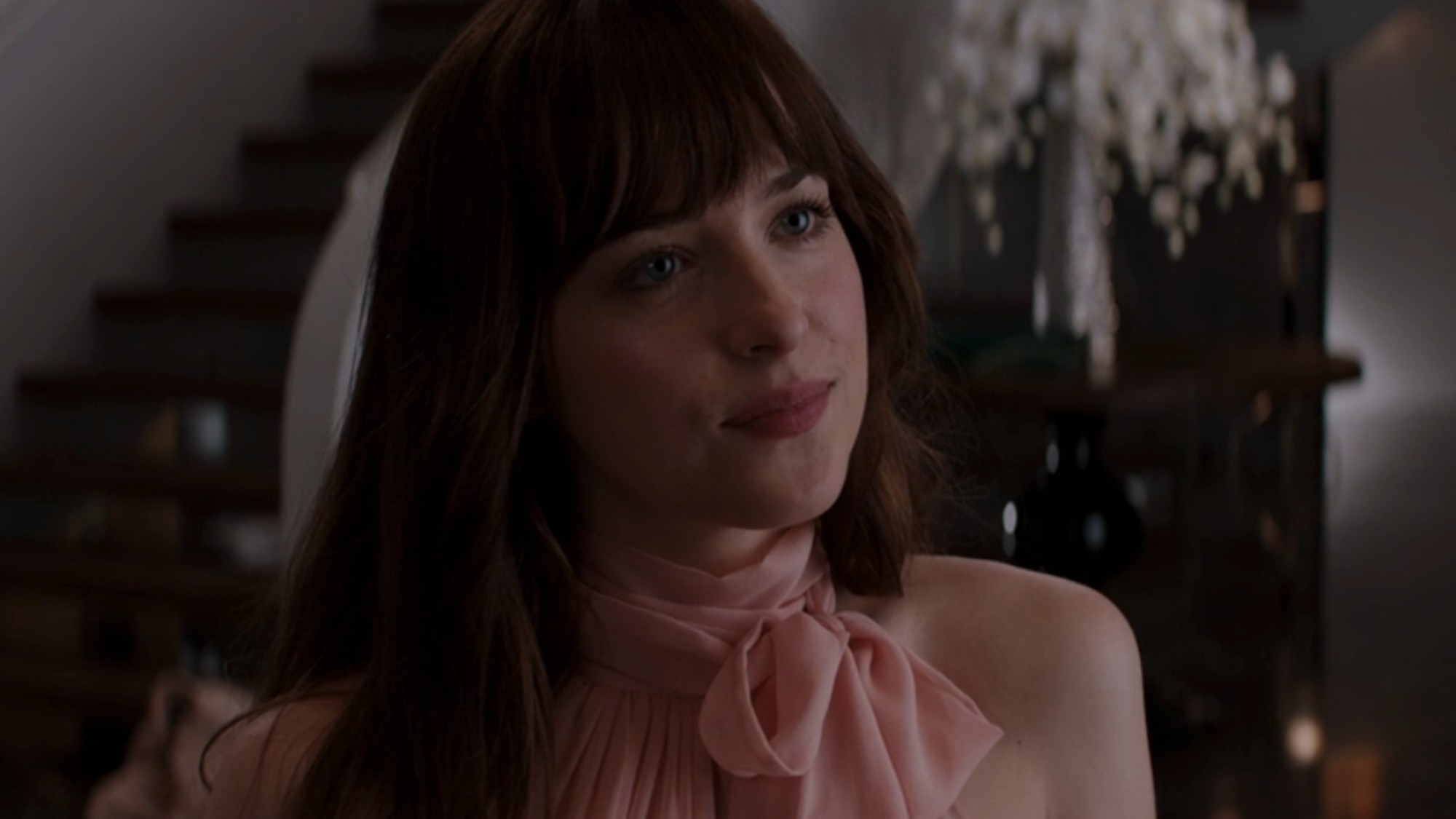 Dakota Johnson in a pink dress in 50 Shades of Grey