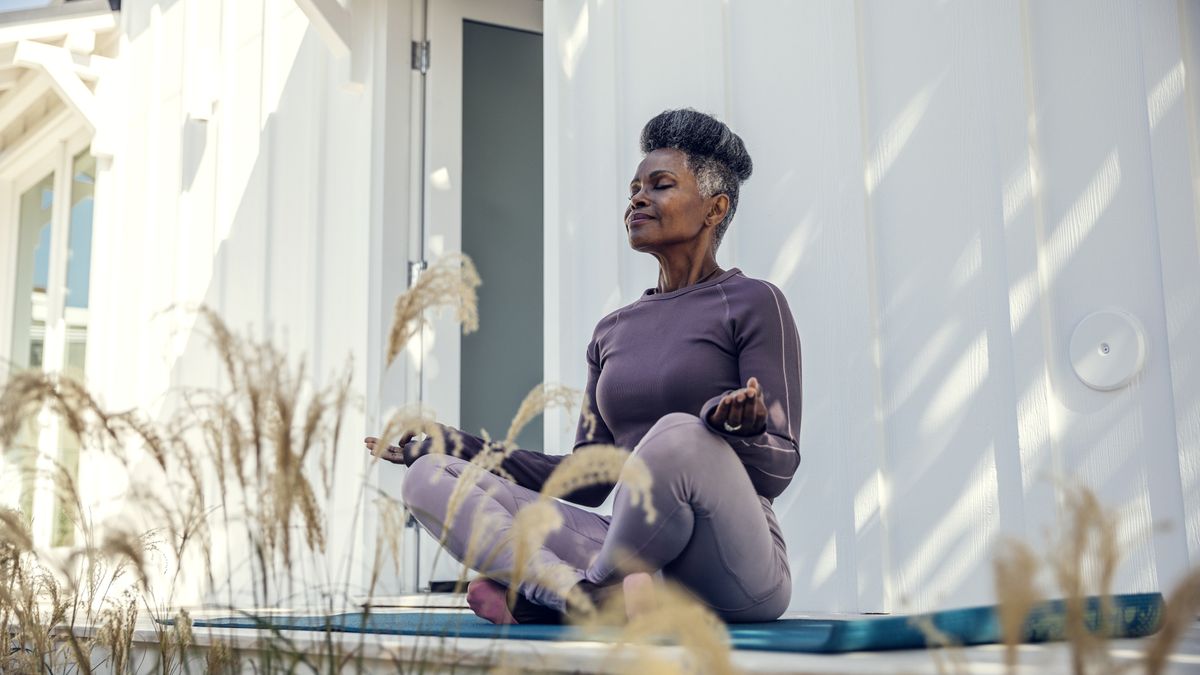 A woman meditating outside