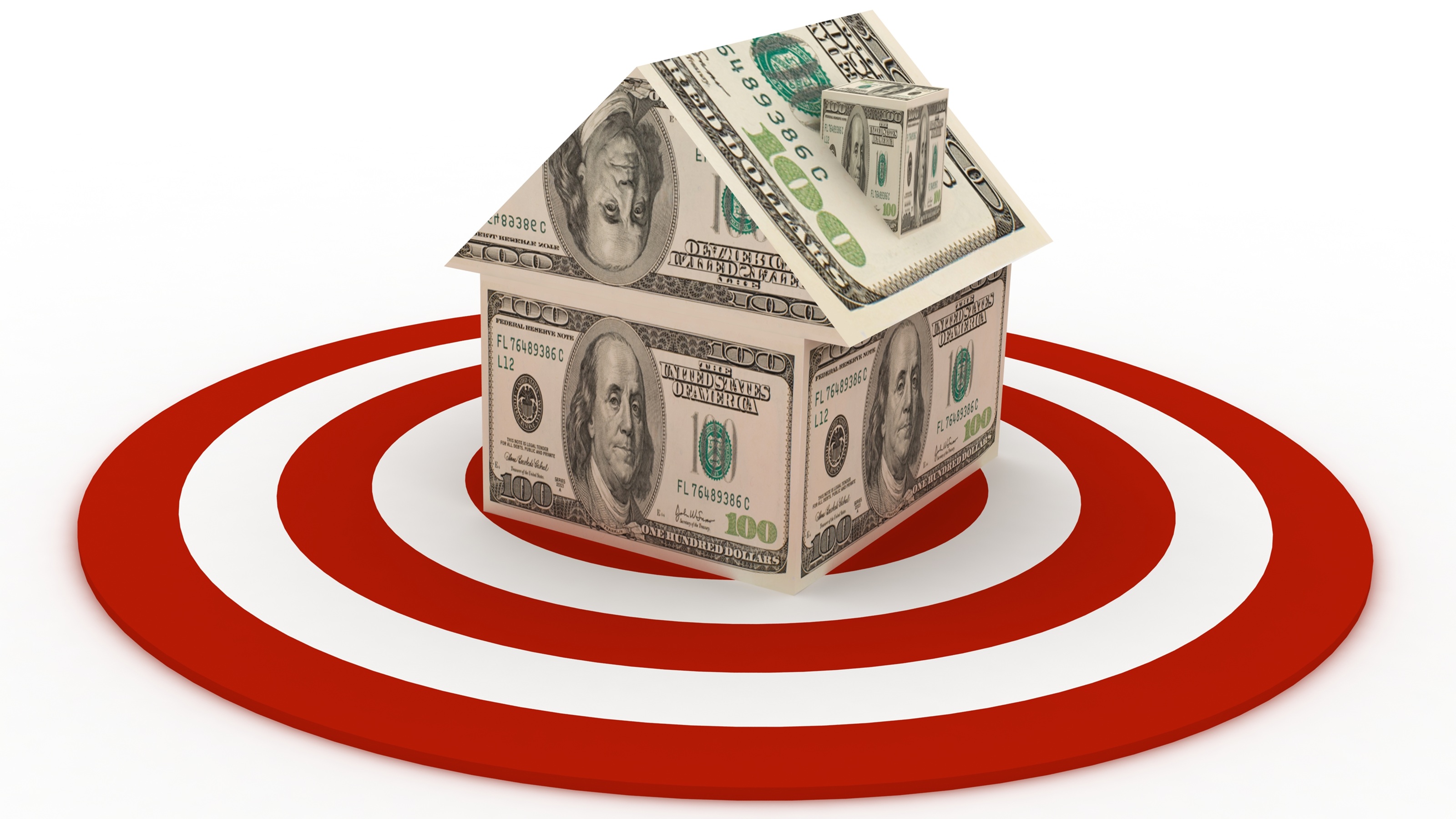 A home constructed of hundred-dollar bills sits in the center of a target.