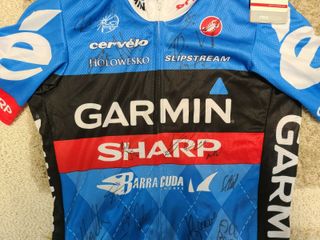 A signed Garmin-Sharp jersey from the 2013 season, signed by members of the team from that season