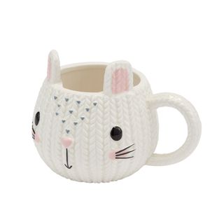 white coloured bunny shaped mug with white background