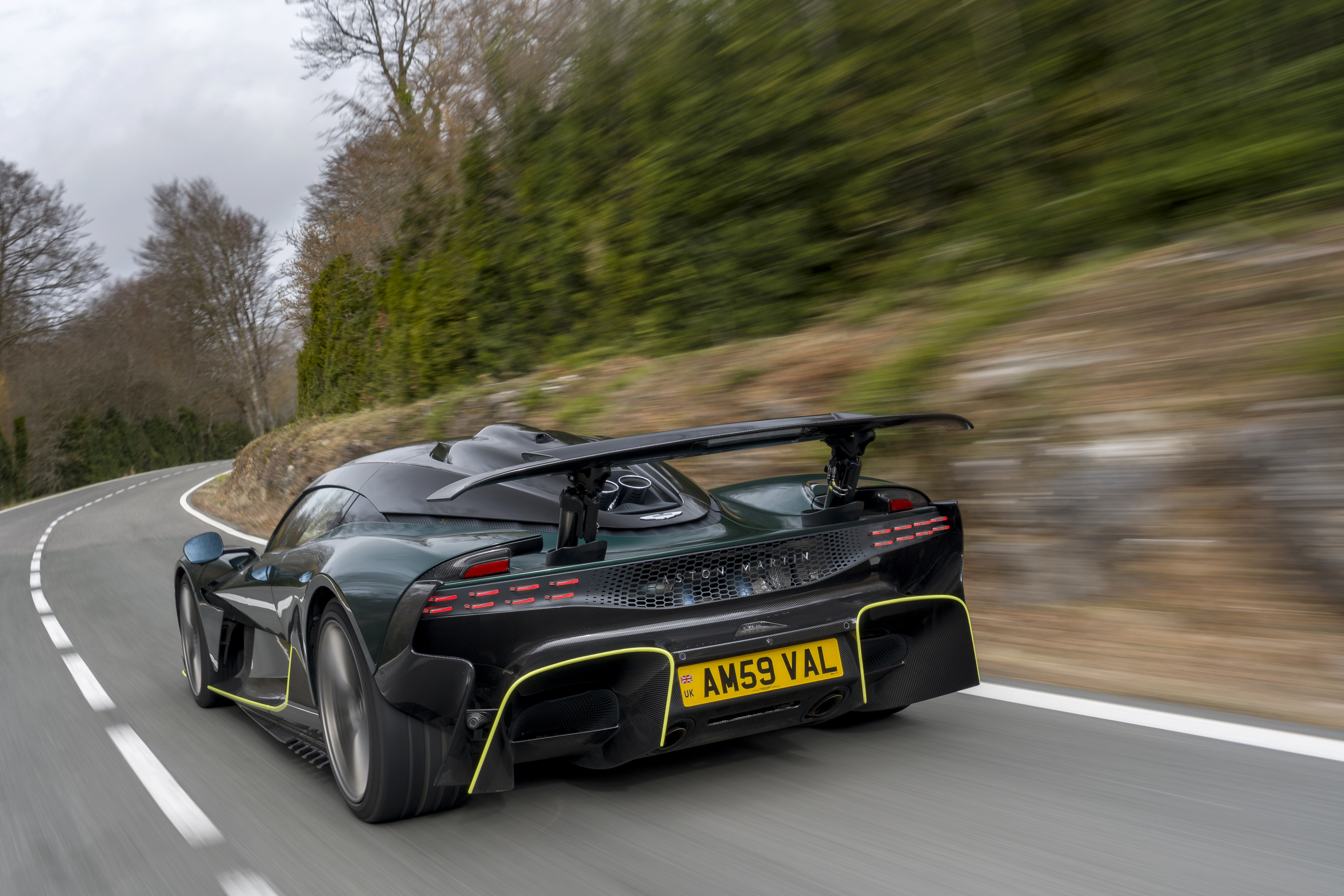 Dynamic rear shot of the Valhalla driving through a mountain road