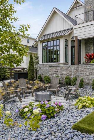 fire pit with adirondack seating by Brad Ramsey Interiors