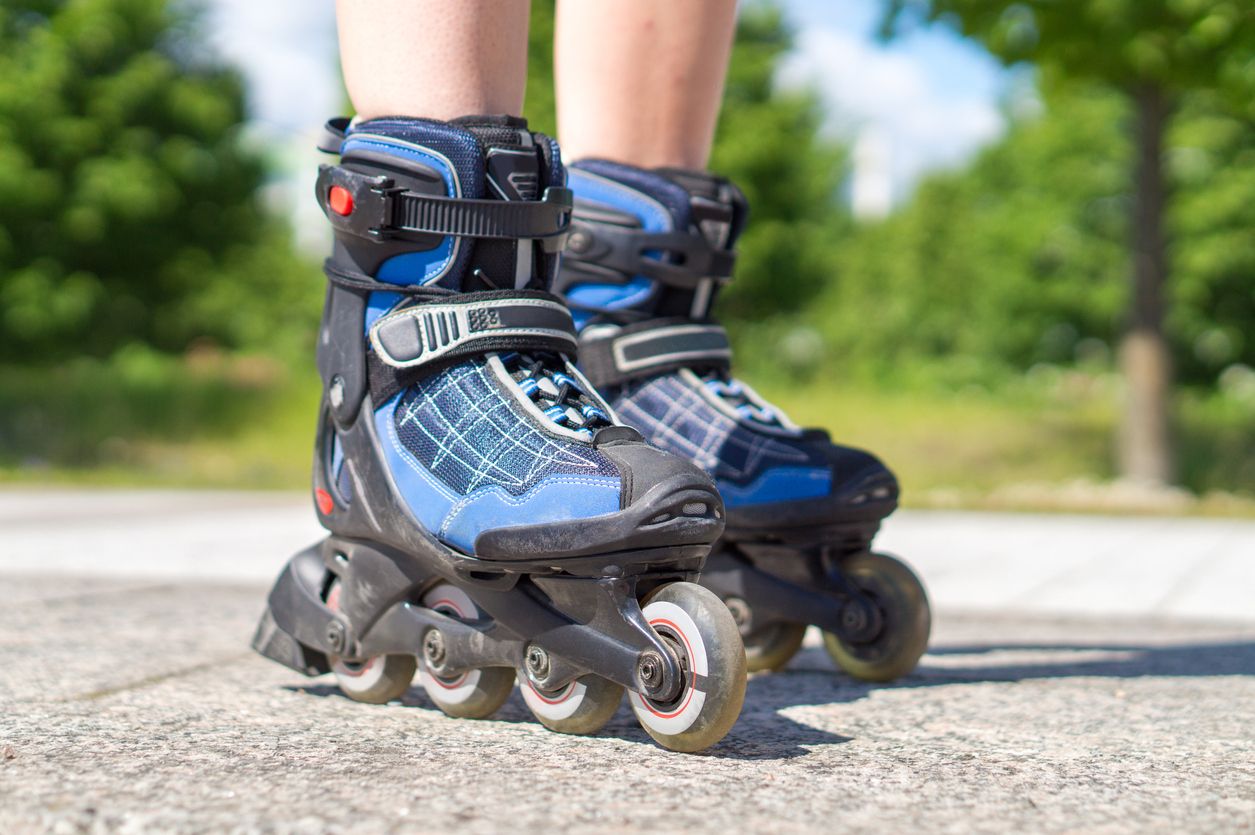 A person rollerblades in the street.