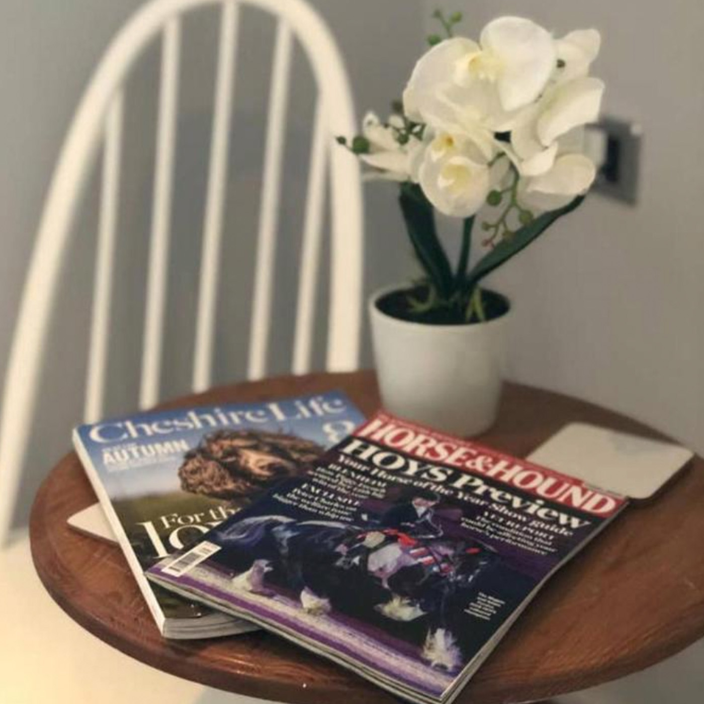 Table in holiday let with magazines on