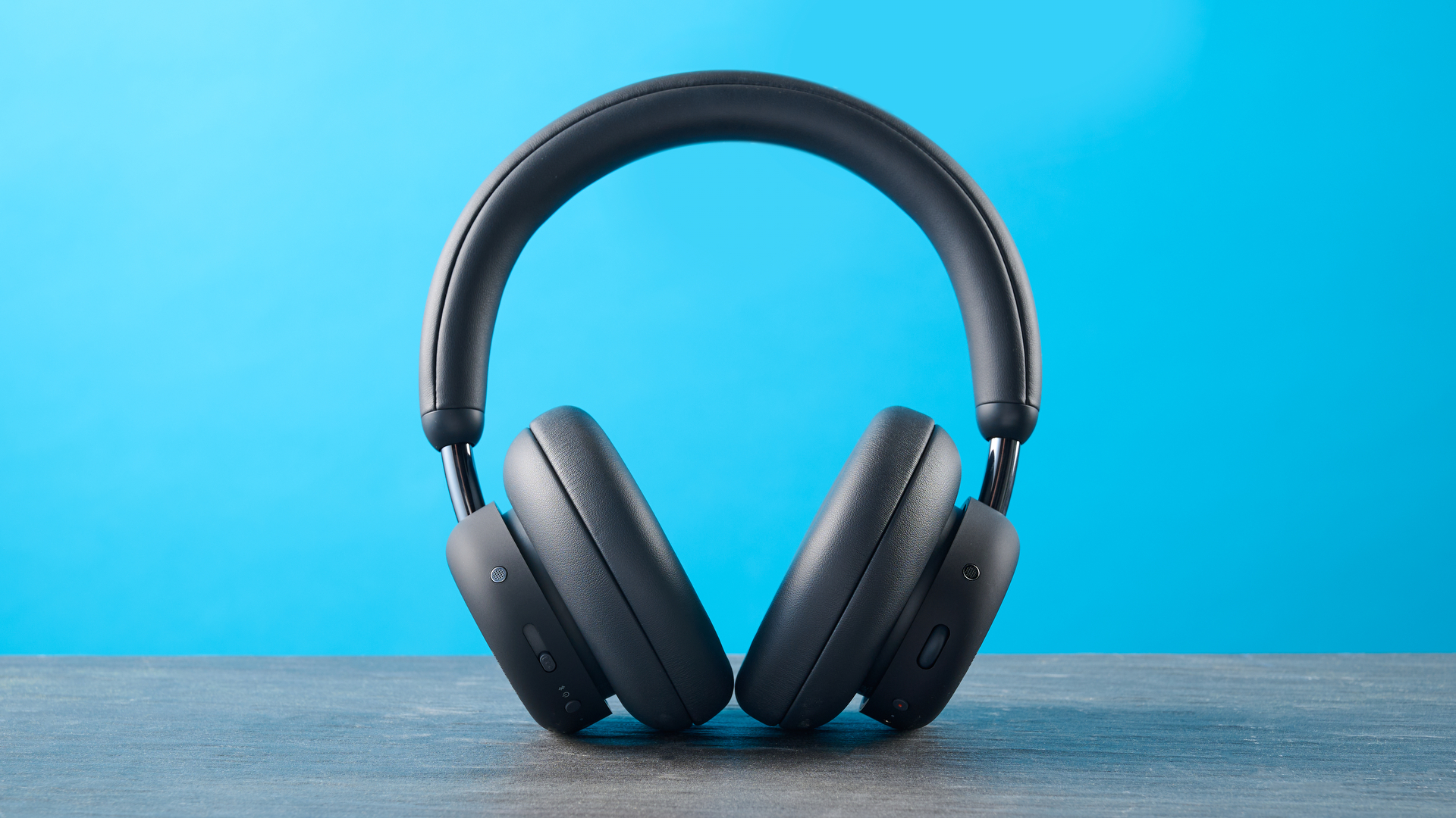 the cmf headphone pro / cmf by nothing headphone pro / nothing headphone pro in black photographed against a blue tom's guide background