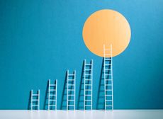 success concept with ladders of increasing height reaching a sun shape