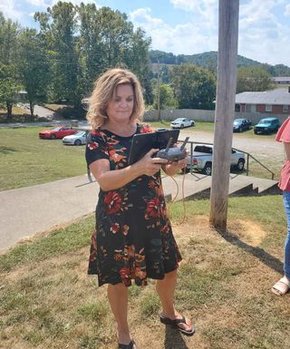 Tina Bobrowski operates drone on school grounds