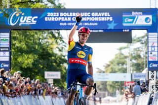 Belgian Jasper Stuyven celebrates as he crosses the finish line to win the elite race at the European and Belgian Gravel Championships in Leuven