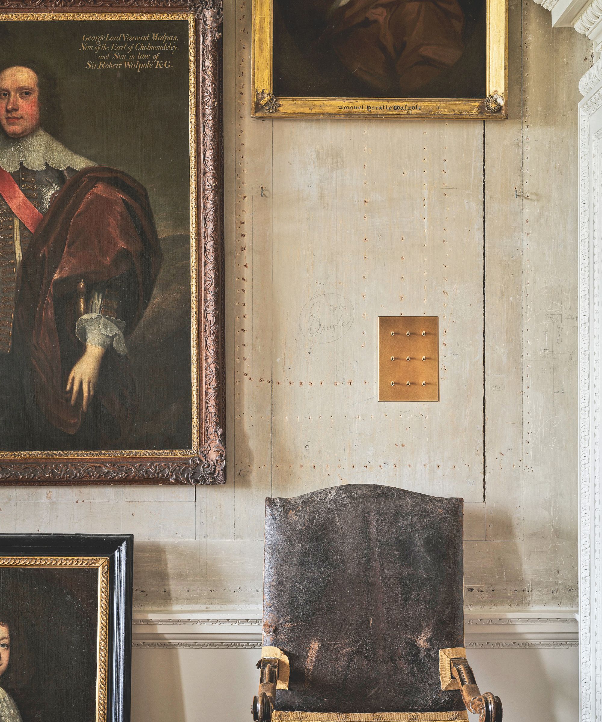 A traditional room with a traditional antique inspired light switch made from brass