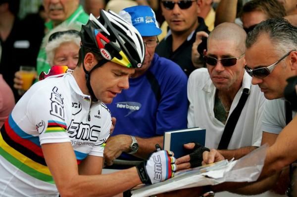 Cadel Evans (BMC) was flocked by autograph hunters at the sign on.