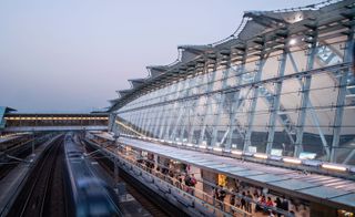 The exterior of Sunny Bay station, capturing the train track and plaform. Photographed at dusk