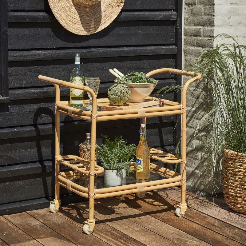 A natural rattan Sika Design bar cart trolley for the best outdoor furniture brands.
