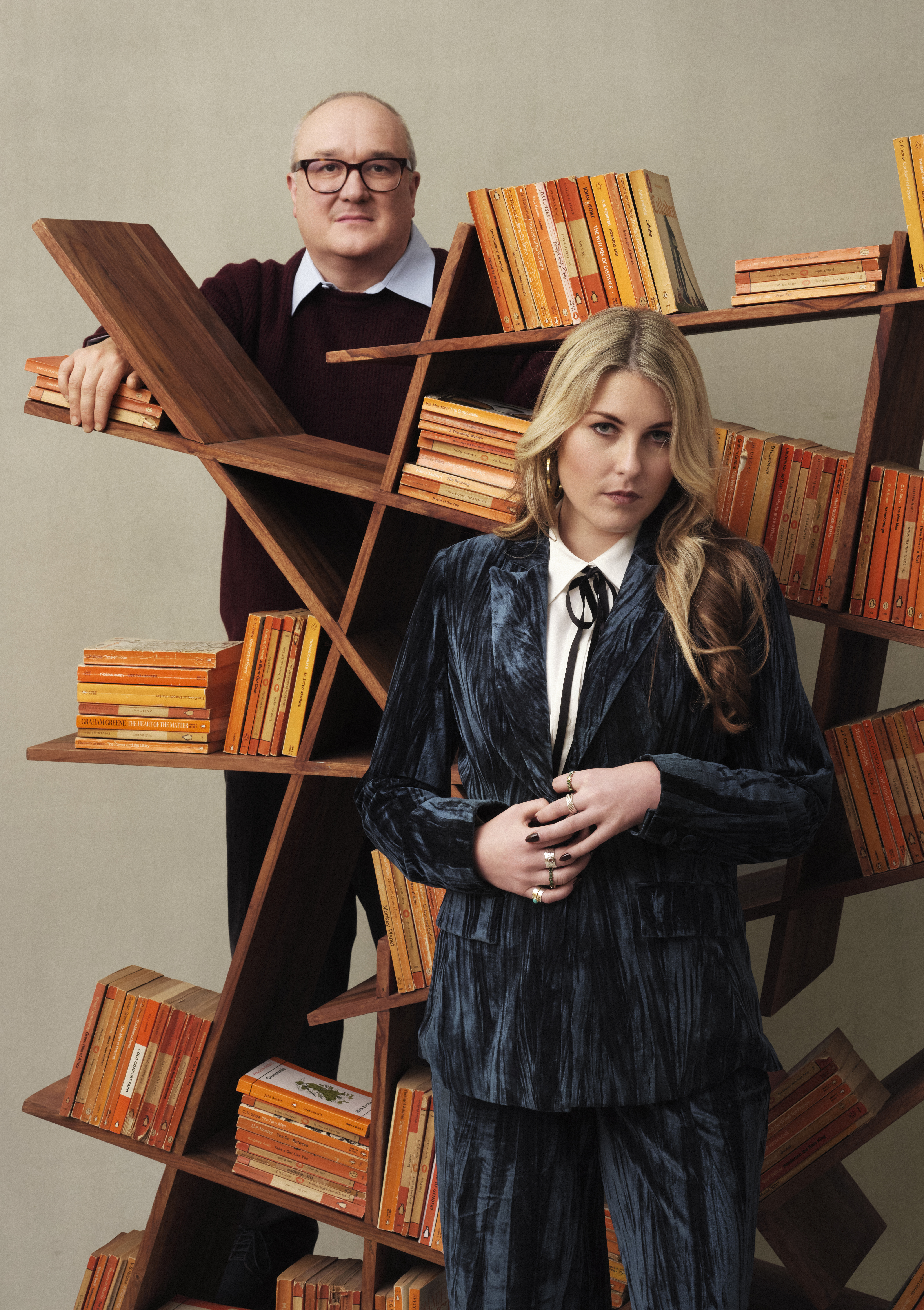 Dominic Sandbrook and Tabitha Syrett with book cases and Penguin classic covers