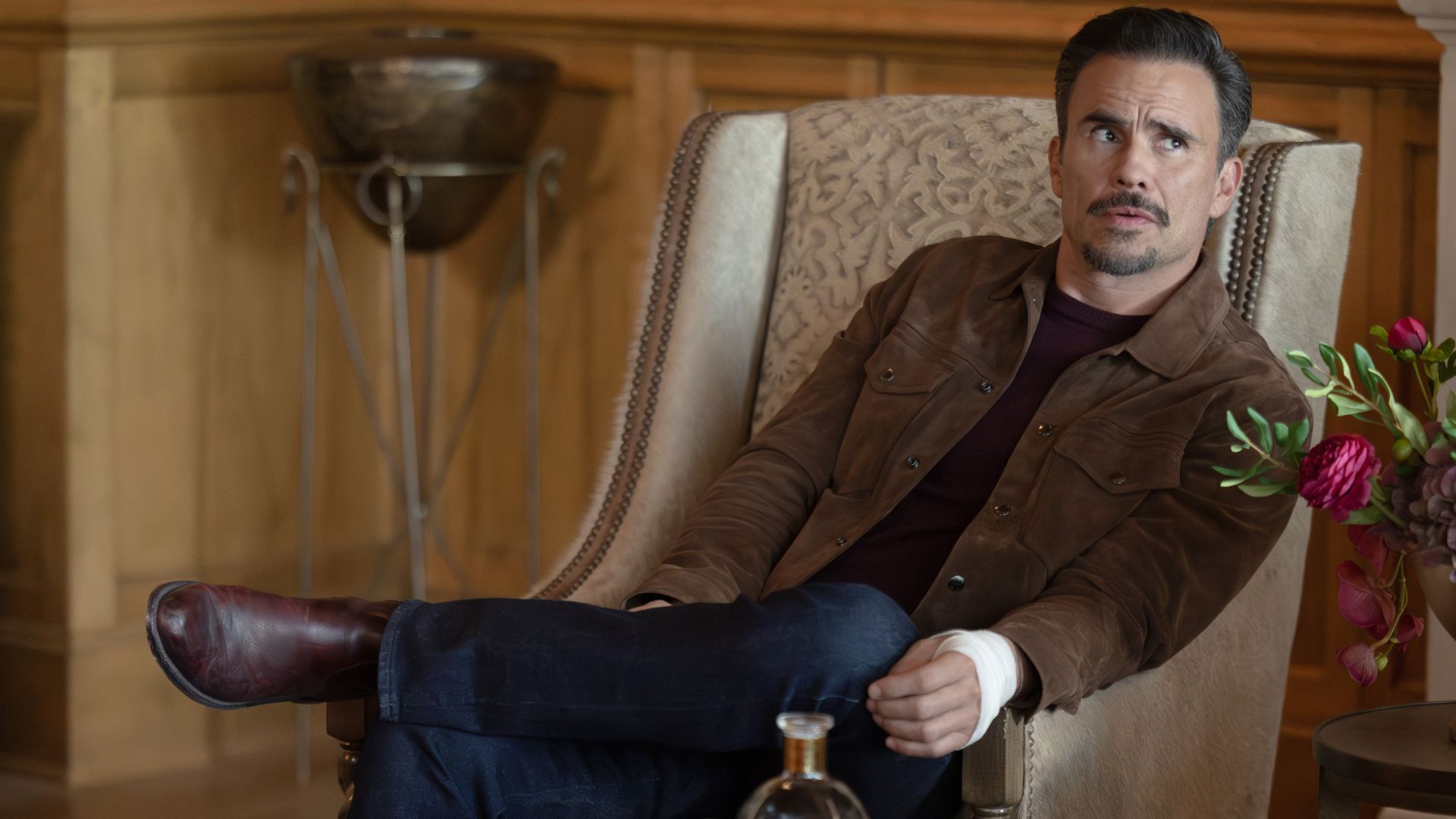 Joaquin sits in a chair