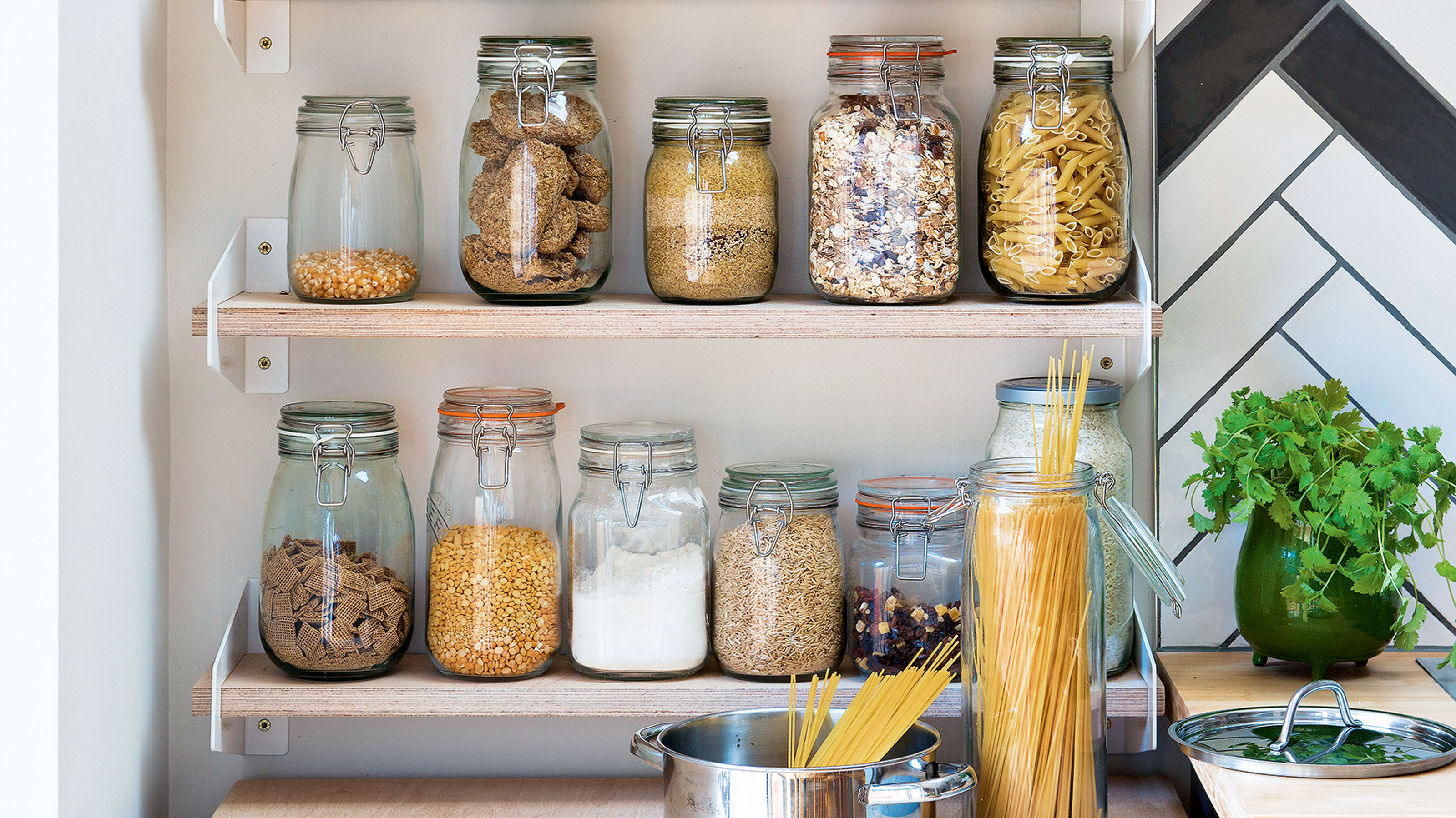 Wooden shelves with kilner jars filled with dried food