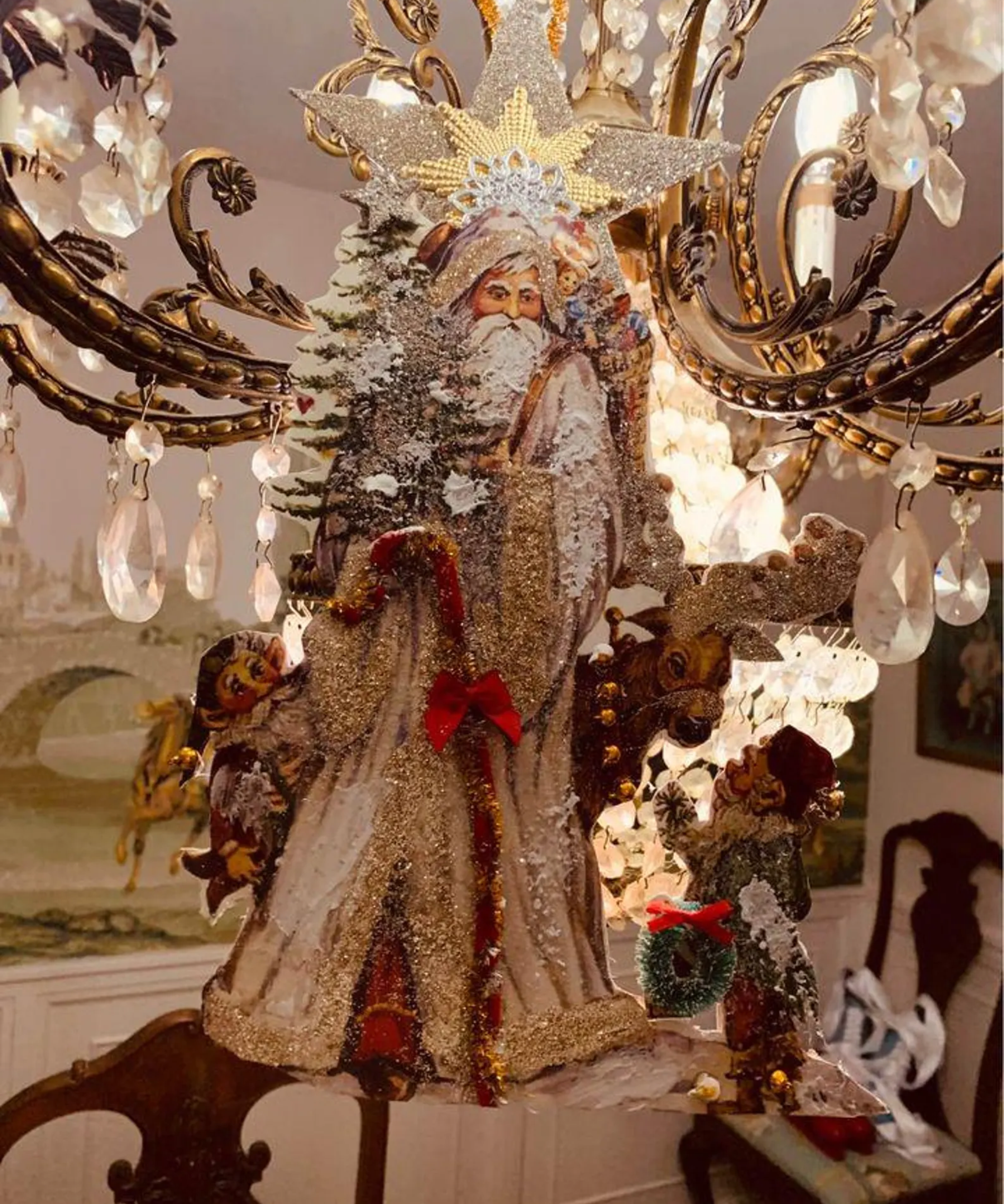 Antique German Santa Claus ornament hanging in an ornate dining room area