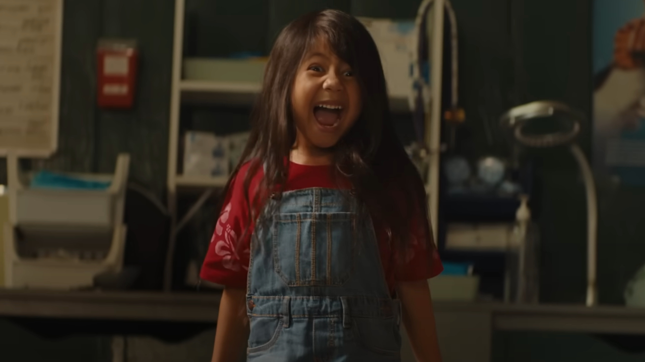 Maia Kealoha stands screaming in delight in the animal shelter in Lilo and Stitch. 