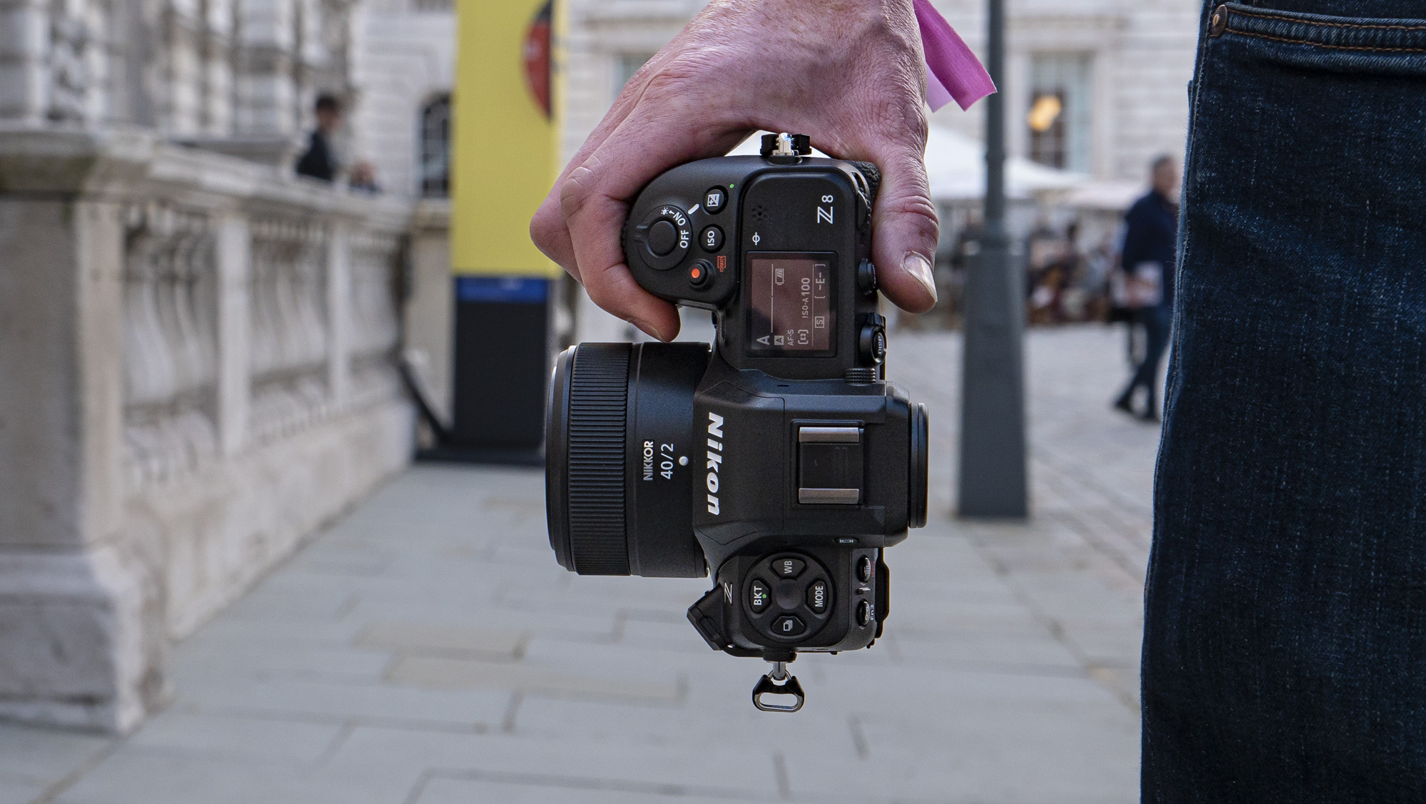 Nikon Z8 camera in the hand with looking at top plate