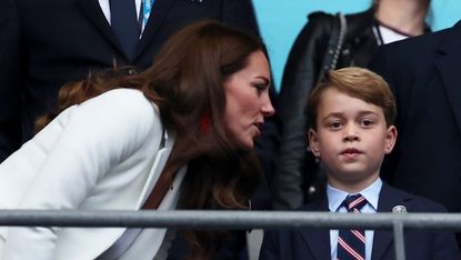 Catherine, Duchess of Cambridge, Prince George of Cambridge and Prince William, Duke of Cambridge and President of the Football Association look on during the UEFA Euro 2020 Championship Final between Italy and England at Wembley Stadium