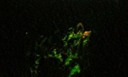 The bright green color of the blob is from "glowing oxygen," according to NASA.