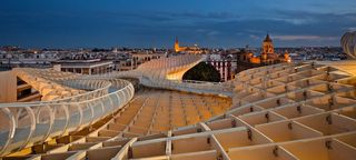 A walkway on top of the structure with city views