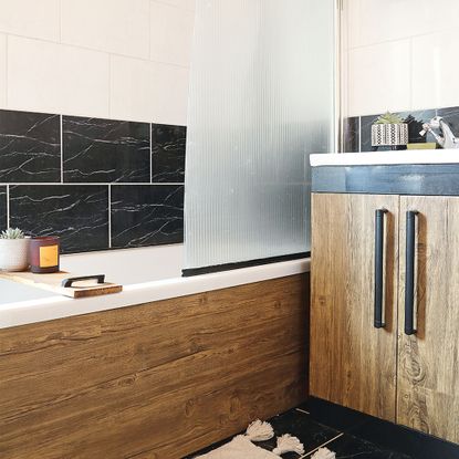 neutral bathroom with wood panel bath