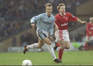 15 Feb 1997: Nicky Summerbee of Manchester City holds off the challenge from Craig Hignett off Middlesbrough during the FA Cup Fifth round match between Manchester City and Middlesbrough at Maine Road in Manchester. Middlesbrough won the match 0-1. \ Mandatory Credit: Shaun Botterill /Allsport