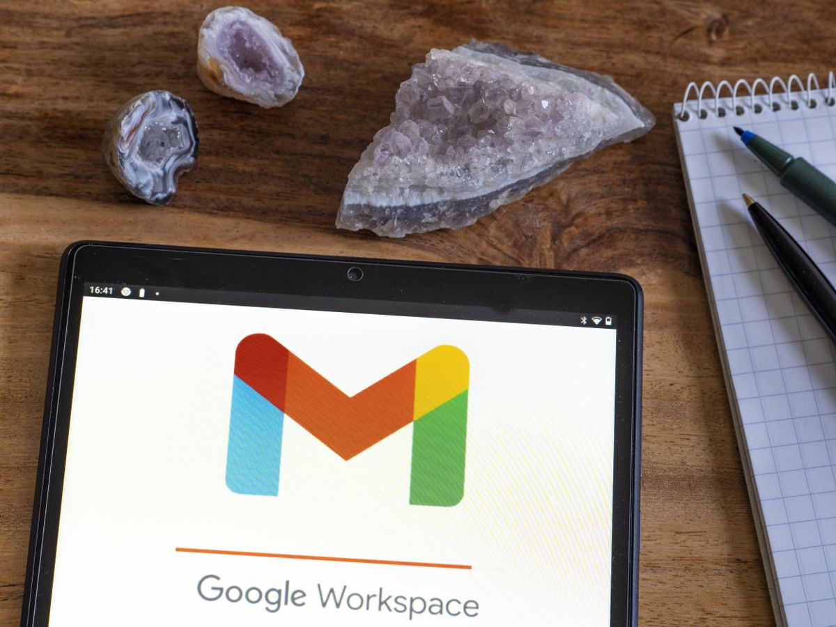 Google Workspace logo and branding displayed on a smartphone sitting on a desk