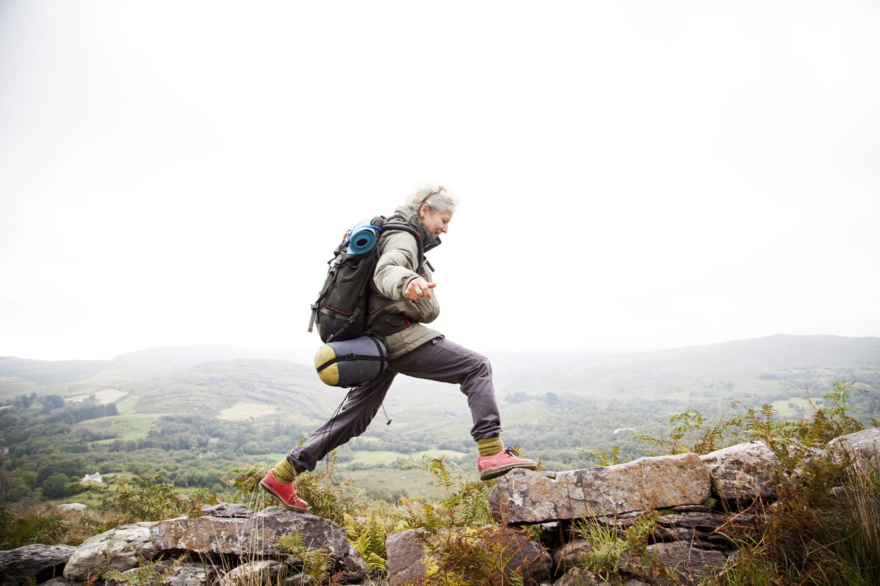 Woman trekking in the mountains of ireland