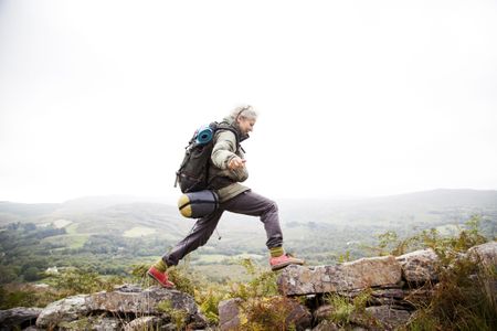 Woman trekking in the mountains of ireland