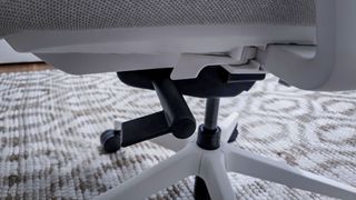 The height adjustment knob on the left side of the Branch Ergonomic Chair Pro