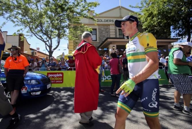 Simon Gerrans on his way to sign in
