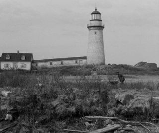 film still of black and white lighthouse
