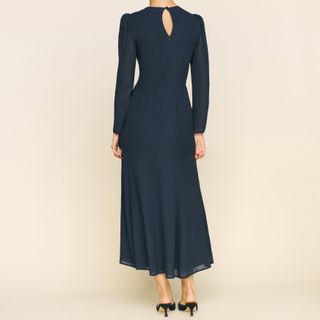 The black long Reformation Lysander Dress seen from behind, with cutout neck detail