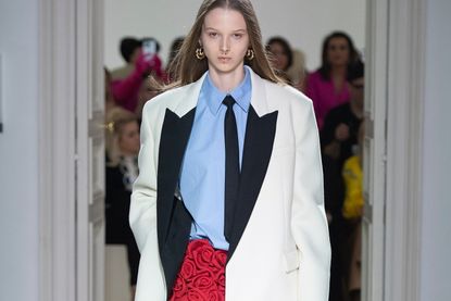 woman wearing a blazer, shirt and tie