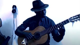 Tosin Abasi plays a Behringer acoustic guitar
